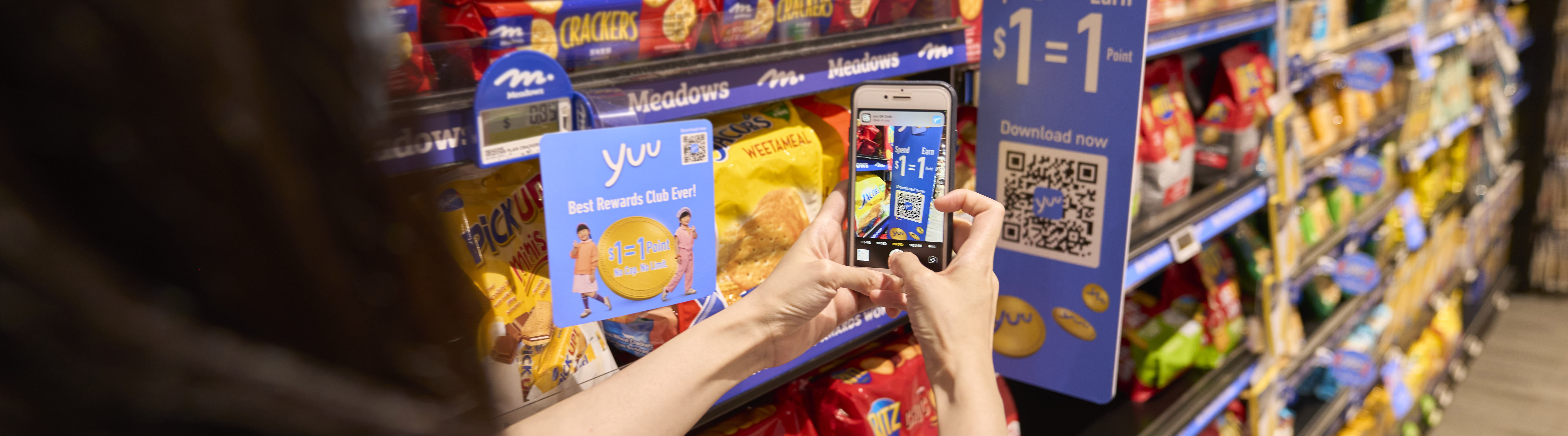 Person using yuu mobile app in store